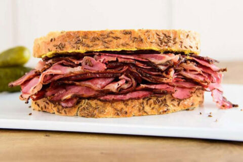 NY style deli pastrami on rye sandwich.