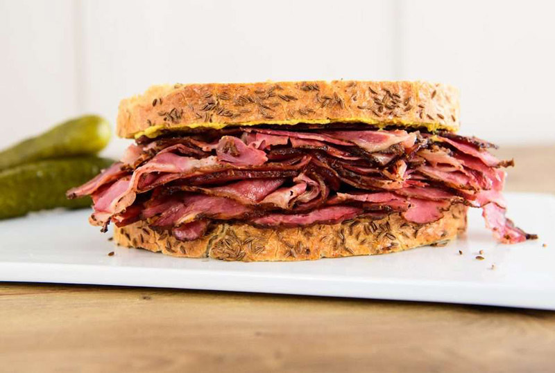 NY style deli pastrami on rye sandwich.