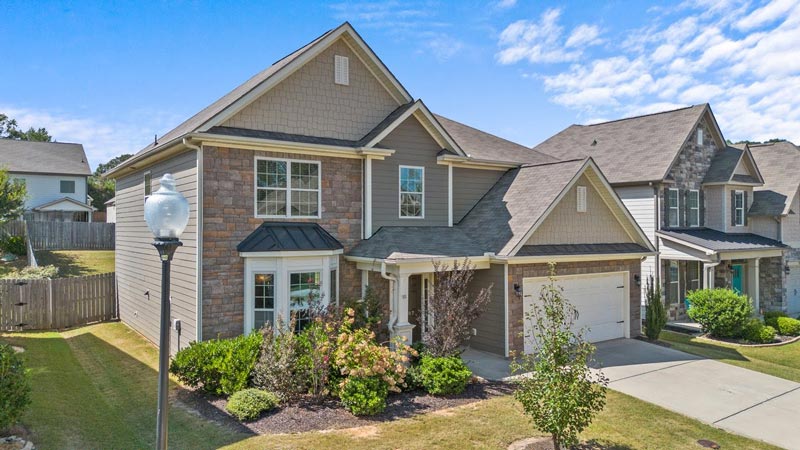 A brown row house for sale